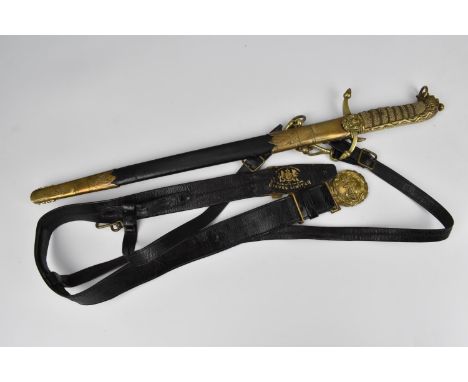 A British Royal Naval Reserve officer's short sword, with black leather scabbard mounted with brass fittings, shagreen and br