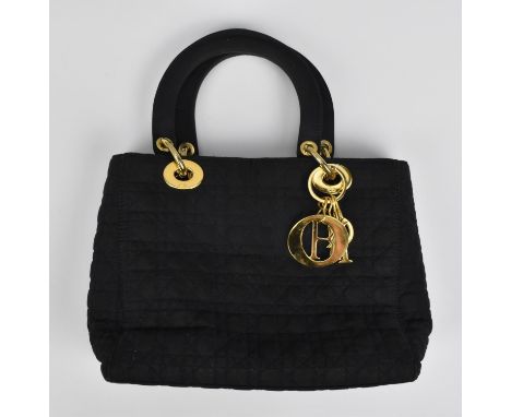 A circa 1990's Christian Dior Lady Dior MM bag in Cannage quilted navy fabric with gold tone hardware having double top handl