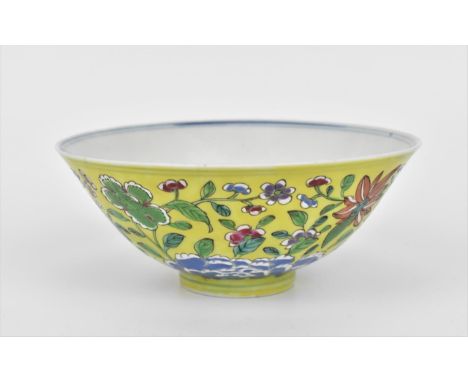 A Chinese Famille Jaune porcelain bowl, with applied polychrome enamel chrysanthemums and other flowers, on a yellow ground, 