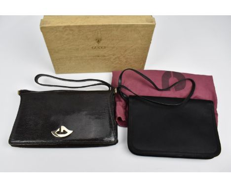 A 1950's Gucci brown mock snakeskin leather handbag with brown suede interior, having a gold crest gold tone zip pull, cursiv