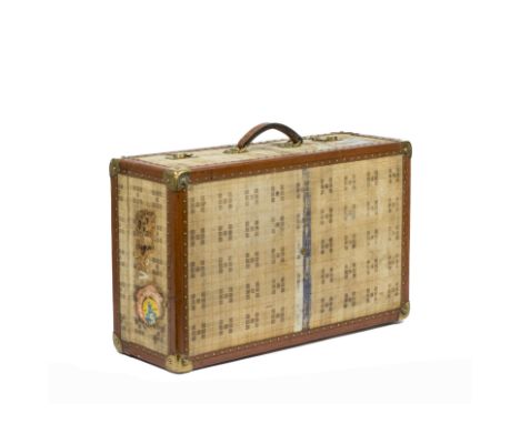 HERMES 24 Fg St Honoré, circa 1934. Valise 60,5 cmEn Toile H chinée beige et imprimée à motif de 'H', bordures en cuir baréni
