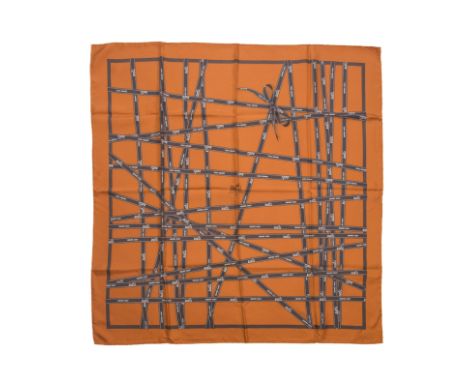 HERMES Paris, circa 2002. Carré 'Bolduc'Dessinateur: Jean Louis DumasEn soie imprimée, fond orange.Petit fil tiré. Bibliograp