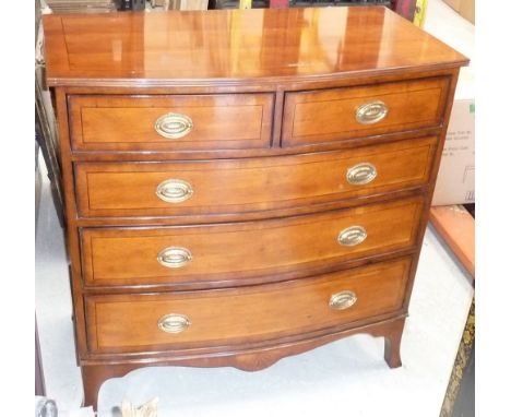 A good modern reproduction yew-wood and crossbanded bow fronted Chest, the reeded top above two half width and three full wid