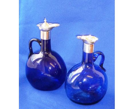 A pair of Bristol blue style glass and silver plated mounted Flasks (one flask now minus hinged top and finial), each Flask w