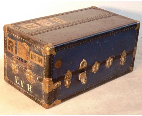 A good early 20th Century Travelling Trunk, single folding end and hinged top opening to reveal upholstered interior, with a 