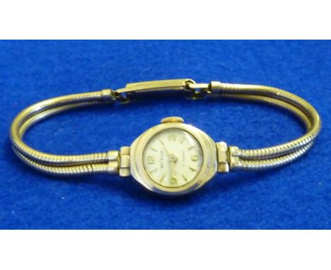 A ladies 9 carat yellow gold cased Cocktail Dress Watch, the cream dial with Arabic numerals and baton markers and signed (in