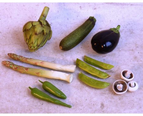 An unusual selection of hand made and painted ceramic Vegetables including Courgettes, Artichokes, Mushrooms, Beans, Asparagu