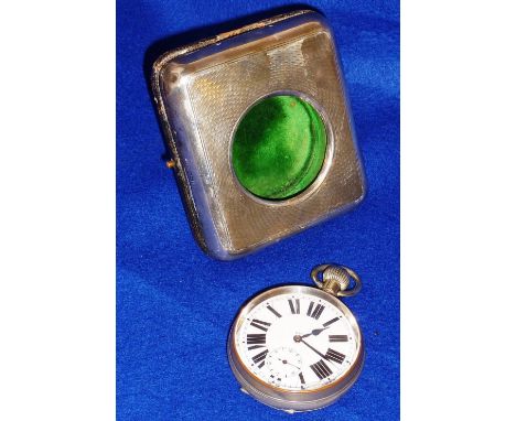 A Goliath style eight day Travelling Clock in the form of an oversized Fob Watch, the white enamel dial with Roman numerals a