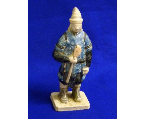 Ming Dynasty (1368-1644) a Chinese pottery Warrior Soldier in mountain pattern armour with a Manchu helmet with plume, the fi