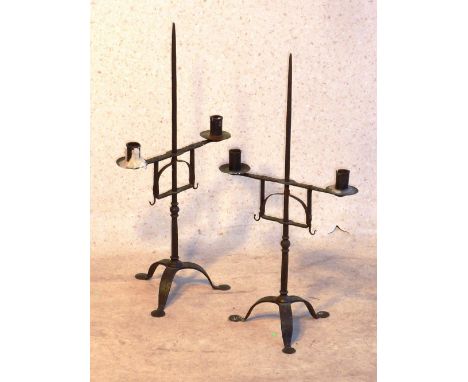 A pair of wrought iron two light Candelabra, each with a central pricket stick, each approx. 57cm (highest) 