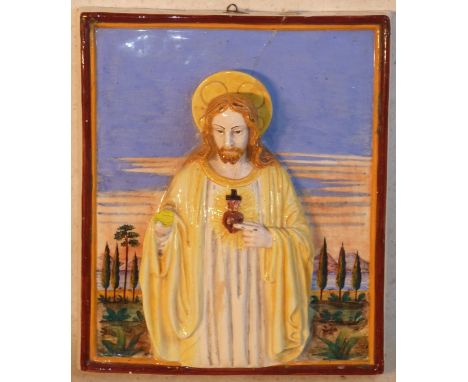 A late 19th Century polychrome decorated Della Robbia ceramic wall hanging Plaque of Christ (damage and reparations), 38cm hi