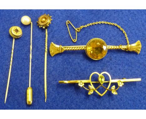 A selection of three late 19th Century Stick Pins together with two yellow metal Bar Brooches, including Scottish style examp