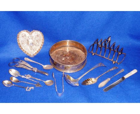 A late 19th/early 20th Century hallmarked silver heart shaped Trinket Dish decorated repousse style with scrolls and a bird u