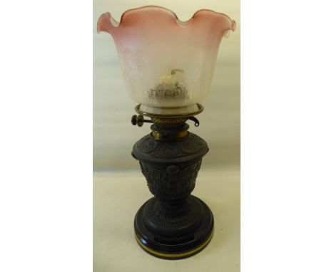 A cast metal Table Oil Lamp with etched glass shade on a classically designed base. 