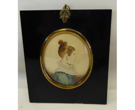 Attributed to JAMES GILLESPIE; An early 19th century miniature oval half length watercolour Portrait of a lady in a green dre