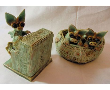 A Yare Figure of a dragon playing the piano and another of two dragons in a bird's nest, both by Sue Turner of Great Yarmouth