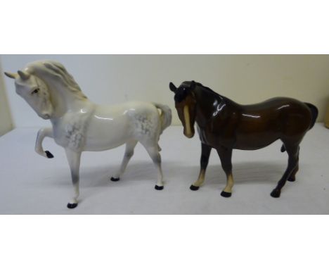 A Beswick Model of a grey horse with head tucked up.  No. 1549, first version and a brown mare facing left. No. 976. 