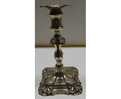 A Victorian silver Taper Stick on a square base, London 1893, 4 1/2" (11cms) high.