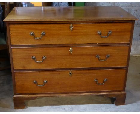 A 19th century mahogany Chest of three long drawers, on bracket feet, 3' 6" (107cms) wide.