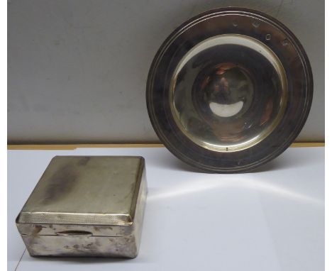 An engine turned silver Cigarette Box and a modern silver circular shallow Dish.