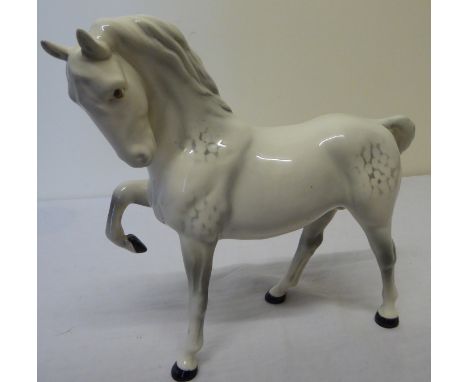 A Beswick Model of a grey horse with head tucked.  No.1549, first version. 