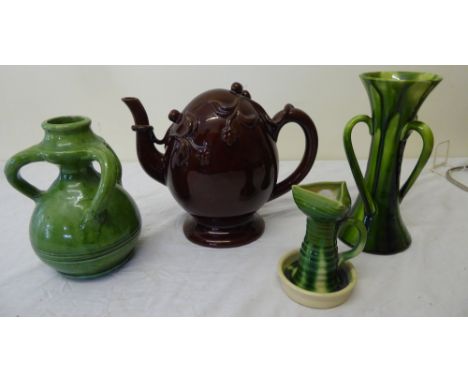 A Copeland Cadogan Teapot moulded with leaves and berries, an Allervale chamber candle stick and two green glazed pottery vas