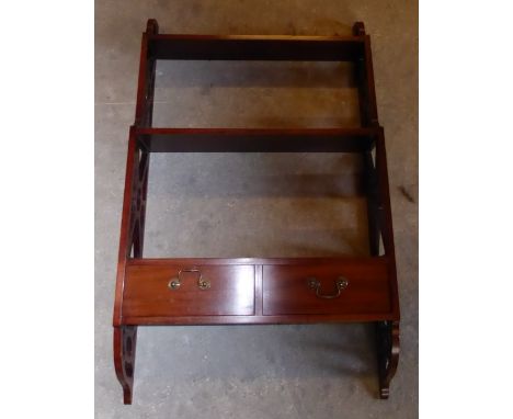 A mahogany Wall Shelf with pierced sides and two drawers, 2' (61cms) wide.