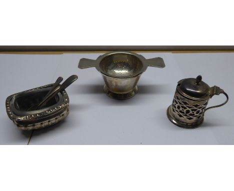 A silver Tea Strainer and Stand, Sheffield 1938, makers: Mappin & Webb; a silver Mustard Pot with blue glass liner, silver ob