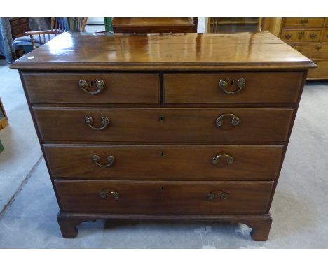 A George III mahogany Chest with moulded edge, fitted three long and two short graduated drawers with brass drop handles, on 