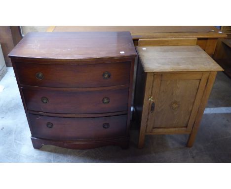 A reproduction mahogany bow fronted Chest of three long drawers, on bracket feet, 2' 8" (81cms) wide, and an oak Bedside Cupb