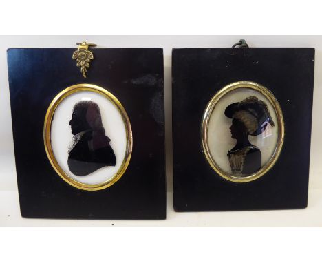 A Silhouette painted on glass of a lady, half length and signed with the initial M in an oval surround and another reverse pa