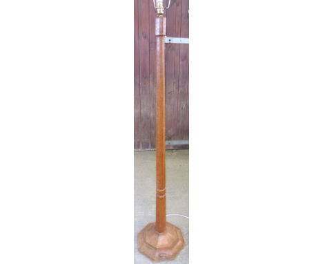 A Thompson of Kilburn "Mouseman" oak Standard Lamp with panel sided column, octagonal base and fringed shade, with carved mou