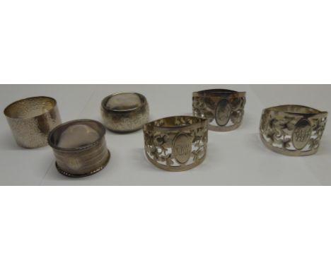 Three pierced silver Napkin Rings decorated with roses and shamrocks, and engraved with initials, Sheffield 1911/12, makers: 