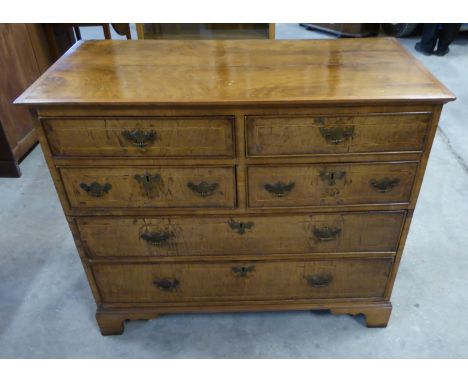 An early Georgian walnut Chest fitted with four short and two long drawers with inlaid decoration, and bracket feet, 3' 3" (9