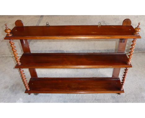 A Victorian rosewood hanging Wall Shelf with three open shelves and spiral turned pilasters, 2' 10" (87cms) wide.