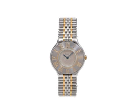A CARTIER LADIES STAINLESS STEEL AND YELLOW GOLD QUARTZ BRACELET WATCH. MUST 21.  Brand: Must de Cartier Model: Must 21 Year: