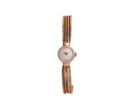 A LADIES OMEGA 9K GOLD MANUAL WATCH. VINTAGE COCKTAIL WATCH.Brand: Omega Model: Cocktail Case reference: 66803 Year: 1959 Mov