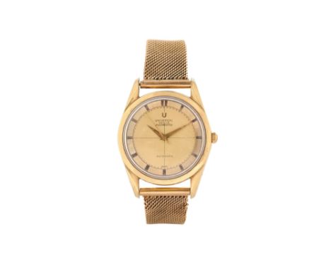 A MEN'S UNIVERSAL GENEVE GOLD PLATED AND 14K YELLOW GOLD AUTOMATIC BRACELET WATCH.  POLEROUTER.Brand: Universal Geneve Model: