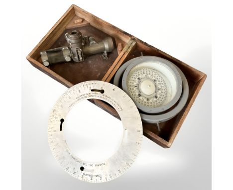 A John Lilley & Gillie Ltd ship's compass in teak case, diameter 26cm, a rifle sighting dial, and a telescope sighting bore M