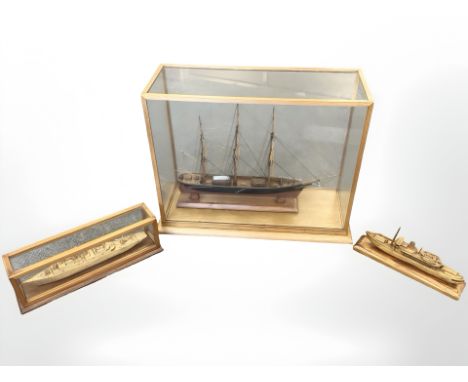 A scale model ship in glazed display case measuring 58cm by 24cm by 45cm, and two further match stick models. (3)
