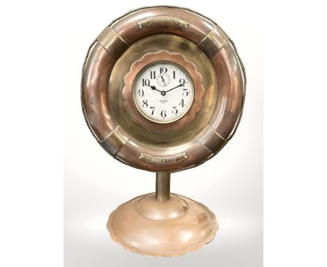 A copper and brass ship's timepiece, signed Westclox, Big Ben, in the form of a life ring, with brass plaques at 12 and 6 o' 