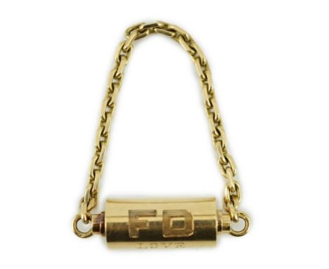 A mid to late 20th century Cartier 18ct gold barrel shaped key ring, with suspension chain and engraved inscription, 'FD LOVE