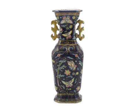 An unusual Chinese blue glazed two handled vase, the porcelain Qianlong period, the enamelled decoration early 19th century E