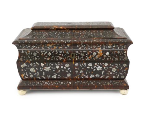 A Regency mother of pearl inset tortoiseshell sarcophagus tea caddy with dense floral decoration to the lid and front, ivory 