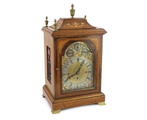 An Edwardian marquetry inlaid mahogany eight day chiming bracket clock in architectural case with cast brass finials, the arc