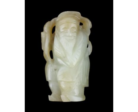 A Chinese pale celadon and russet jade figure of an old man, 18th / 19th century, holding a peach branch over his shoulder, 6