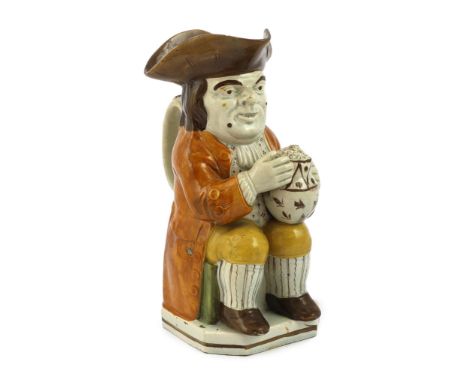 A Staffordshire Prattware Toby jug, c.1790-1800, seated in standard pose holding a frothing beer mug, painted in semi-translu