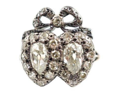 A 19th century gold, silver and diamond cluster set twin hearts ring, with ribbon bow surmounted, the two main pear cut stone