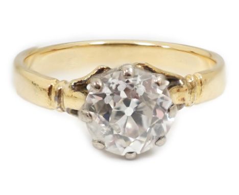 A gold and solitaire diamond set ring, the round cut stone measuring 6.3mm in diameter, with a depth of 4.2mm, size K/L, gros