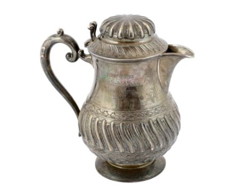 A late Victorian demi fluted wrythened silver water jug, by Mappin &amp; Webb, with engraved inscription relating to 'First P